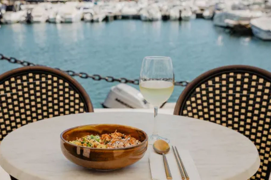 Table with food and wine by marina.