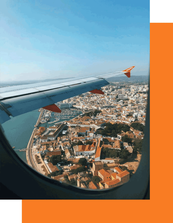 Aerial view of city from airplane window.