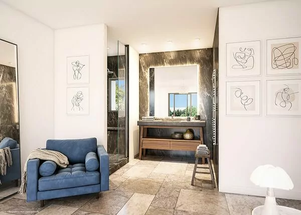 Salle de bain moderne avec fauteuil et art abstrait.