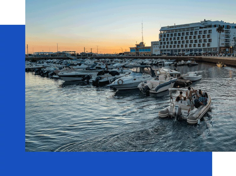Boats in marina at sunset