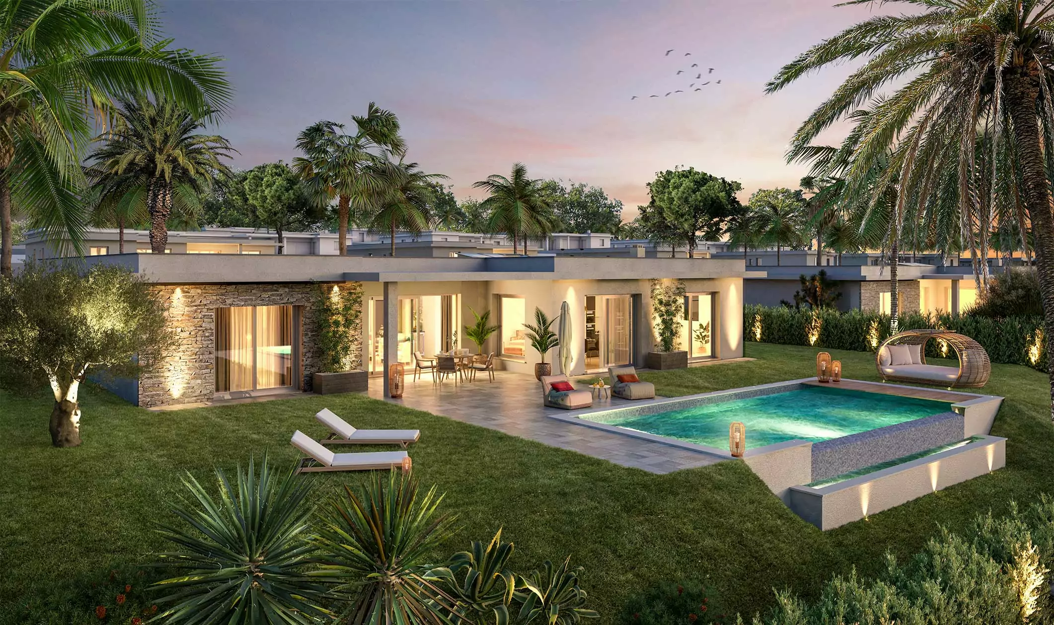 Luxurious villa with pool and palm trees at sunset.