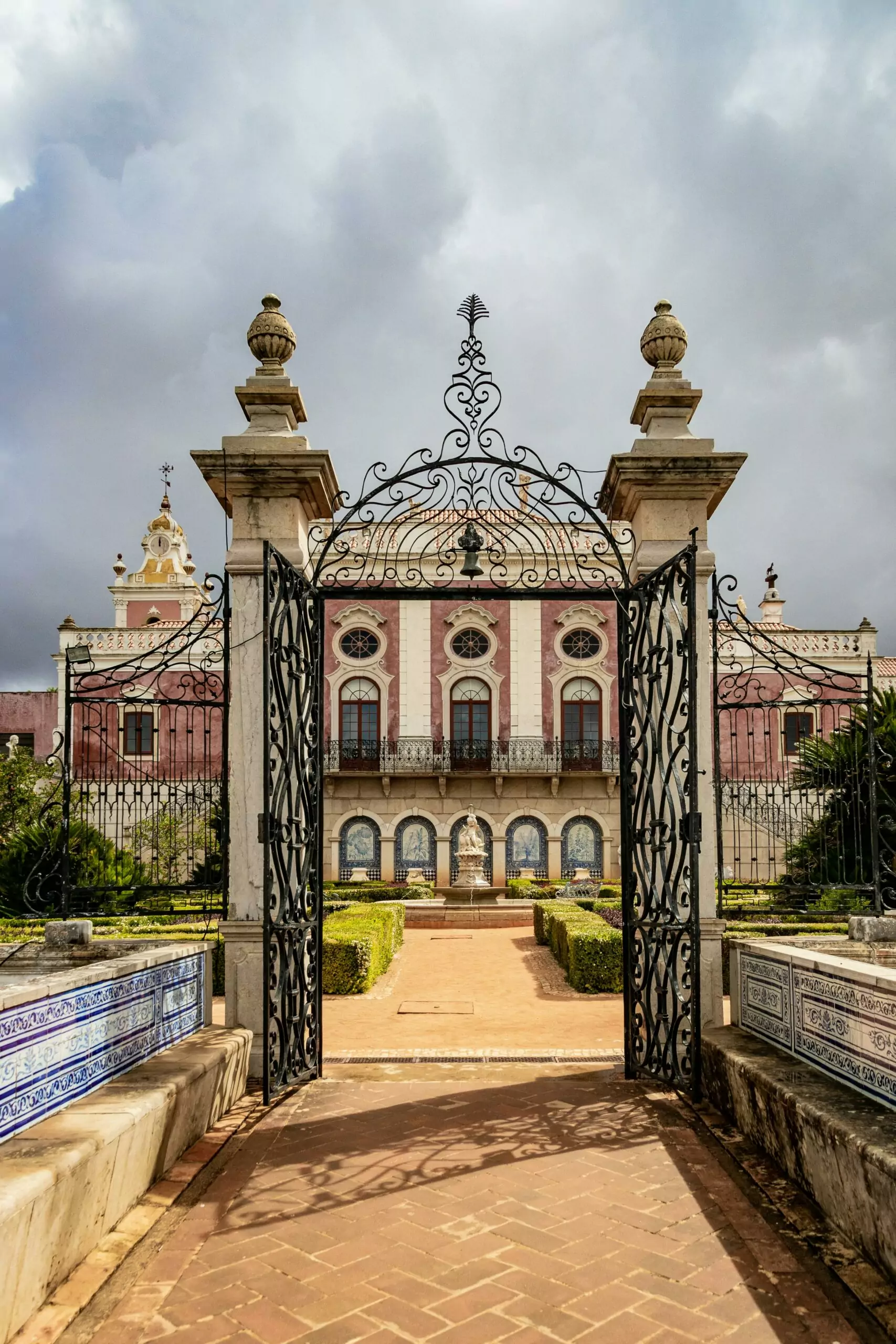 pexels-magda-ehlers-pexels-2606600 Ornate gate opens to historical mansion gardens.