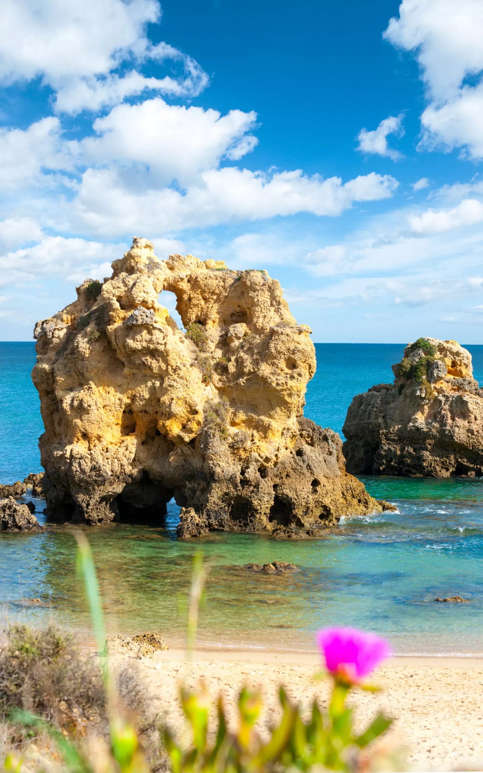 Seashore in Southern Portugal Rocky coastline with clear blue water