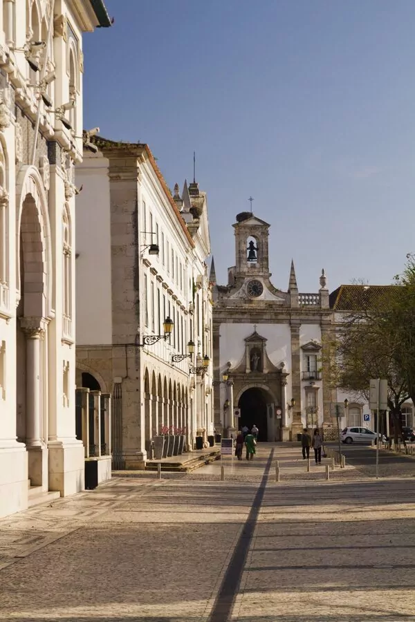 Historic church in Faro, Portugal under clear sky.