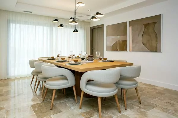 Modern dining room with elegant decor and lighting.