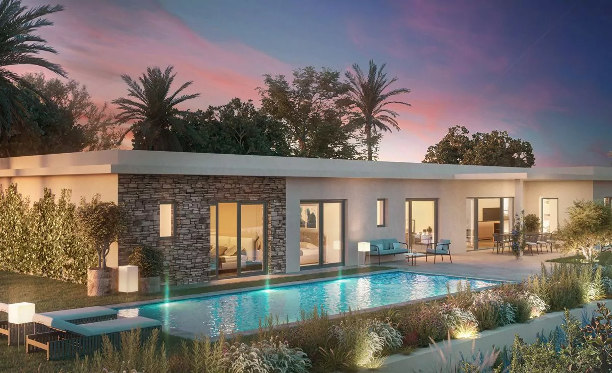Modern house with large windows and stone accents, surrounded by palm trees. Features a rectangular pool with deck lighting, against a sunset sky. A nice Villa.